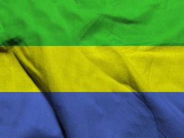 Kumaşın dalgalı yüzeyinde Gabon bayrağı 
