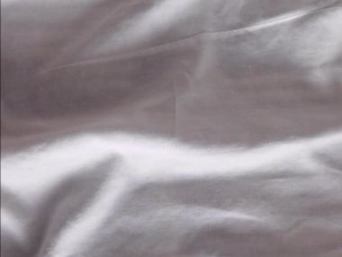 Gri buruşmuş kumaş dokusu arkaplanı.