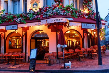 Paris, France - April 06, 2024 : Exterior of La Boheme restaurant decorated with flowers . it located on Place du Tertre square in Montmartre clipart