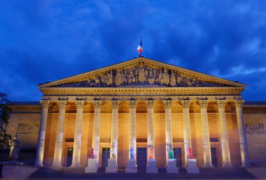 Paris, France-April 24, 2024 : The National Assembly- Bourbon Palace with six sculptures representing Olympism on its steps, to celebrate sport and art. It imagined by artist Laurent Perbos. clipart