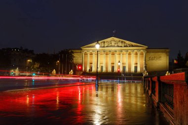 The French national Assembly-Bourbon palaceat rainy night . It the lower house of the parliament , Paris, France. The palace was built in 1722. clipart