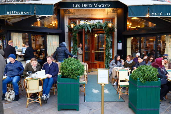 PARIS, FRANCE - November 30 , 2024: A famous cafe Les Deux Magots located at the corner of boulevard Saint Germain and rue Saint Benoit. It was once home to intellectual stars, from Hemingway to Picasso
