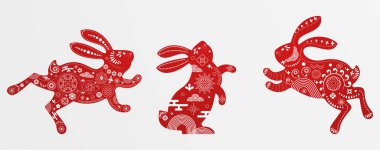 Zıplayan ve oturan tavşanlar. Geleneksel Çin desenli Zodiac hayvanları. Mutlu Çin Yeni Yılı. Bahar festivali ve Paskalya tatili dekorasyonu. Kağıt kesim stili. Düz vektör illüstrasyonu.