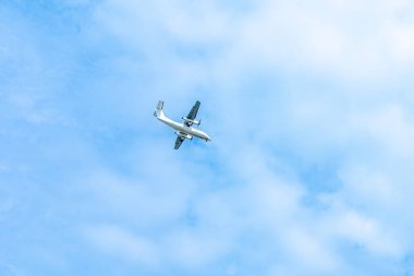 landing plane on blue sky with clouds. High quality photo
