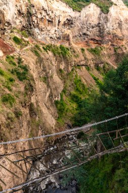 old suspension bridge over the chasm. High quality photo