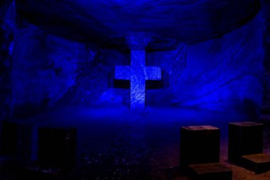 Salt Cathedral of Zipaquira in Colombia, colorfully illuminated cross in the wall. 