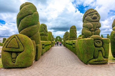 Tulcan, Ecuador - October 8, 2022: cemetery with green sculptures made of plants. 
