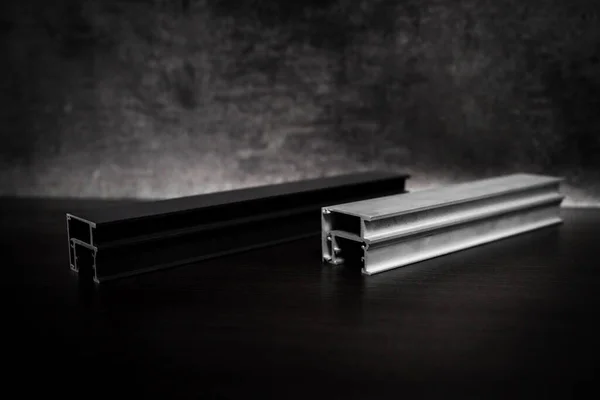 stainless steel profile on a dark background, product photo.