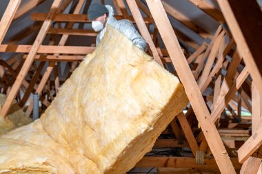 insulation of the roof and ceiling with glass wool. 