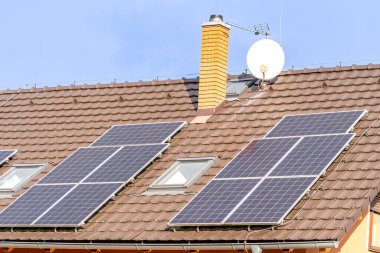 solar panels for the production of electricity from the sun on the roof of a family house. High quality photo