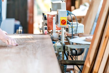 gluing the edge on a machine to a laminate board for the production of furniture in carpentry. High quality photo