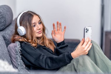 child communicates online at home with the help of modern technologies. High quality photo