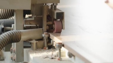 gluing the edge on a machine to a laminate board for the production of furniture in carpentry. High quality photo
