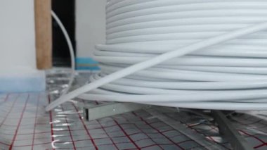 roll with pipe for underfloor heating in a new building. High quality video