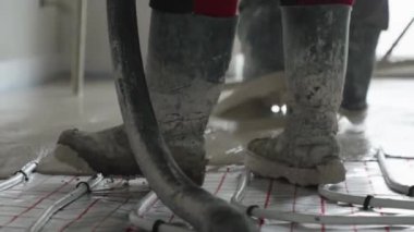 covering the floor heating with anhydride and concrete. High quality video
