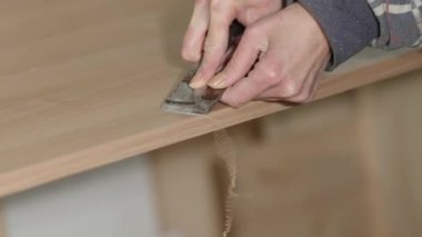 cleaning glue from the edge of laminate in carpentry. 