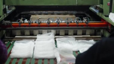 production of plastic packaging in a factory on an automated line. 