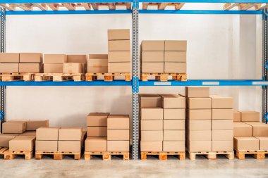 shelves with goods in cardboard boxes in the warehouse. High quality photo