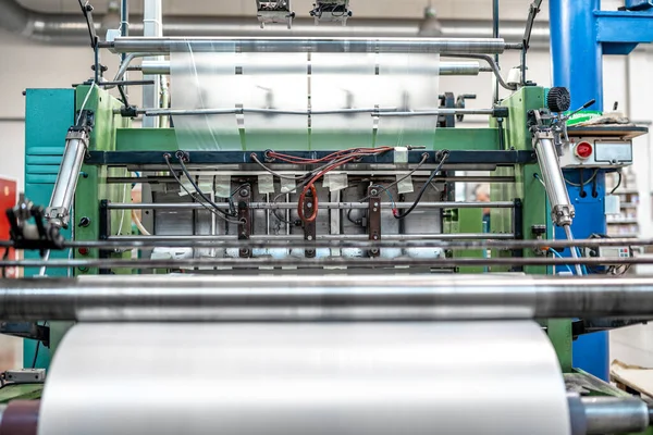 production of plastic packaging in a factory on an automated line.
