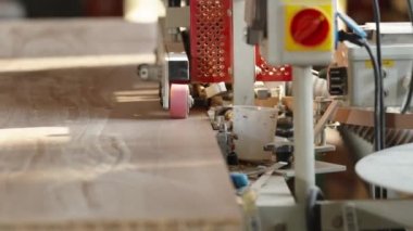 gluing the edge on a machine to a laminate board for the production of furniture in carpentry. High quality video