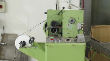 robotically automated machine for the production of plastic bags in a factory. High quality 4k footage