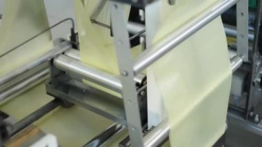 production of plastic bags and packaging on machines in the factory. 