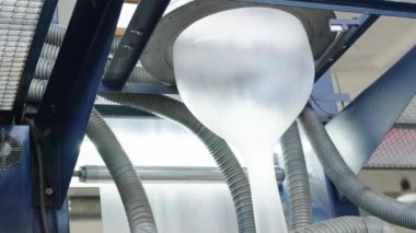 production of plastic bags and packaging on machines in the factory. 