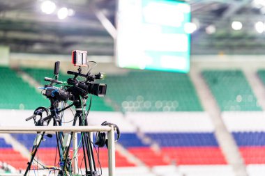 professional video camera broadcasting a football match. High quality photo