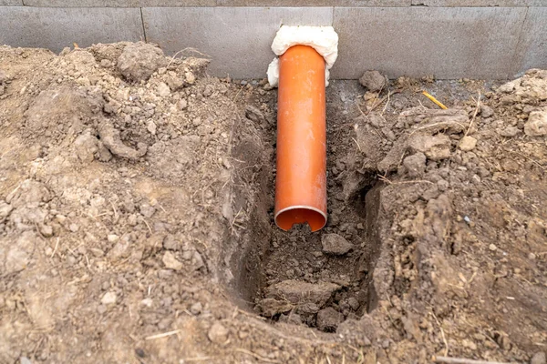 plastic pipe for sewage network in the base plate at the construction site.