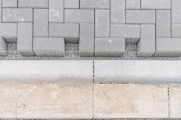 concrete blocks for the construction of sidewalks and roads.