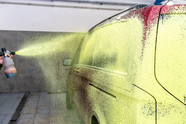 stock image wash cars with green active foam in the garage. High quality photo