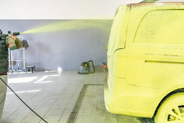 wash cars with green active foam in the garage. High quality photo
