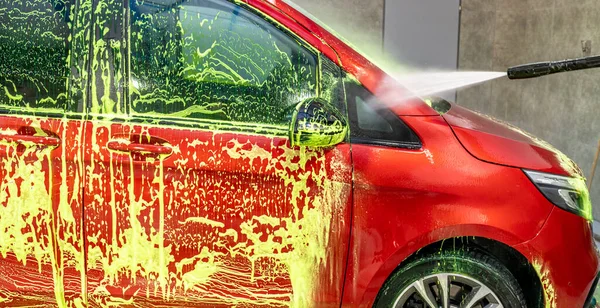 wash cars with green active foam in the garage. High quality photo