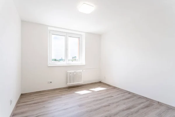 stock image empty room with white walls in a new building, apartment for rent. High quality photo