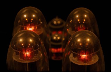 Hifi Amplifier's Vacuum Tubes Glowing in the Dark. clipart