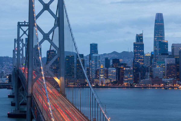 Cars Crossing San Francisco-Oakland Bay Bridge Leaving Light Trails at the Blue Hour. Treasure Island, San Francisco, California.