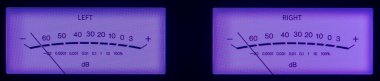 Audio Dual Volume Unit Meters Glowing in the Dark with Purple Hue. clipart