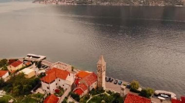 Areal shot over the Kotor bay.4K drone shot of the landscape,culture and buildings in Montenegro.Bay,houses and the water.Mountains are in the background.Summer adventures with drone in Montenegro.