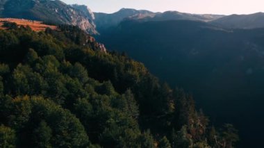 Areal shot over the Durmitor national park in Montenegro.4k drone shot, of the wild nature and valley.Summer adventures in Montenegro.Last rays of the sun. Beautiful landscape of the Durmitor.