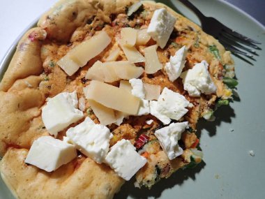 portion of egg omelette served on a plate