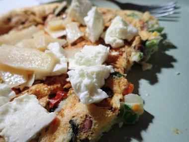 portion of egg omelette served on a plate