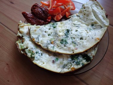 portion of egg omelette served on a plate