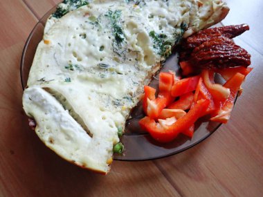 portion of egg omelette served on a plate