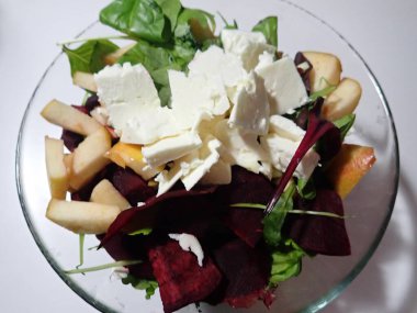 a portion of warm fresh vegetable salad served