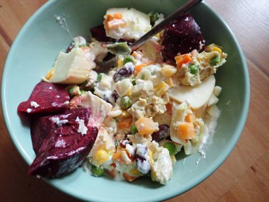 a portion of warm fresh vegetable salad served