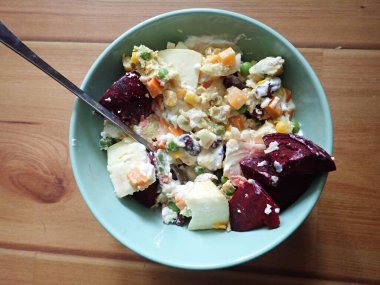 a portion of warm fresh vegetable salad served