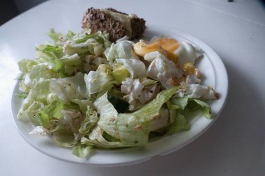 fresh scrambled egge with vegetables on a plate