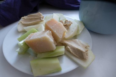 cheese and green vegetable snack on a plate