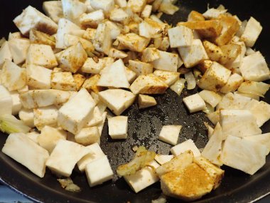 cooking a fresh homemade vegetable curry  in kitchen