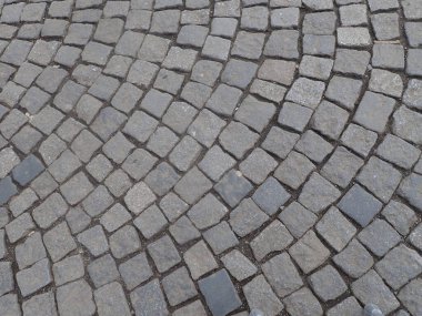 detail of grey granite street tiles texture